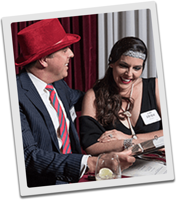Cincinnati Murder Mystery couple checking out the dinner menu